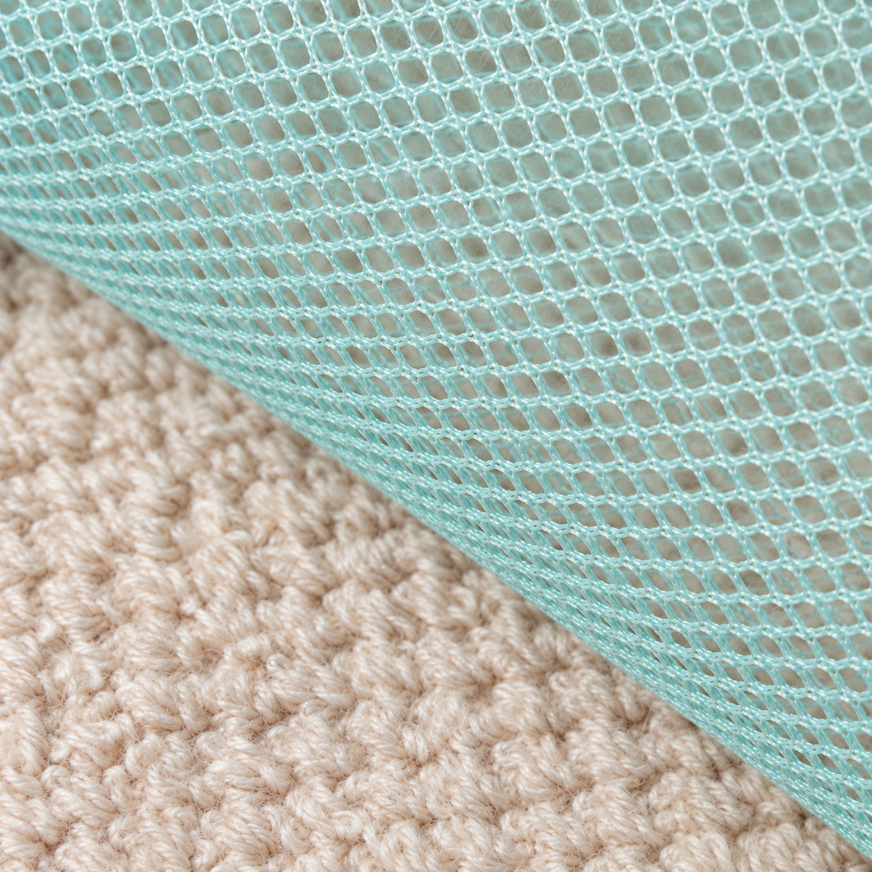 Retouched close-up of the lake-blue mesh panel and fabric binding